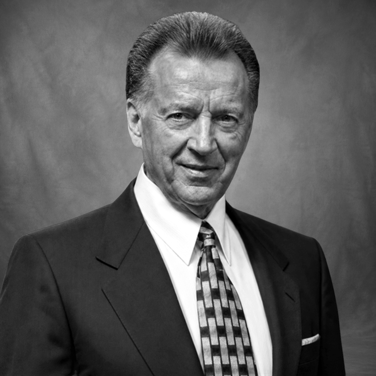 Black-and-white obituary portrait of Carl Robert "Bob" Leal
